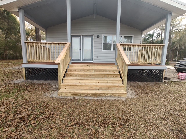 Wide porch steps with railings